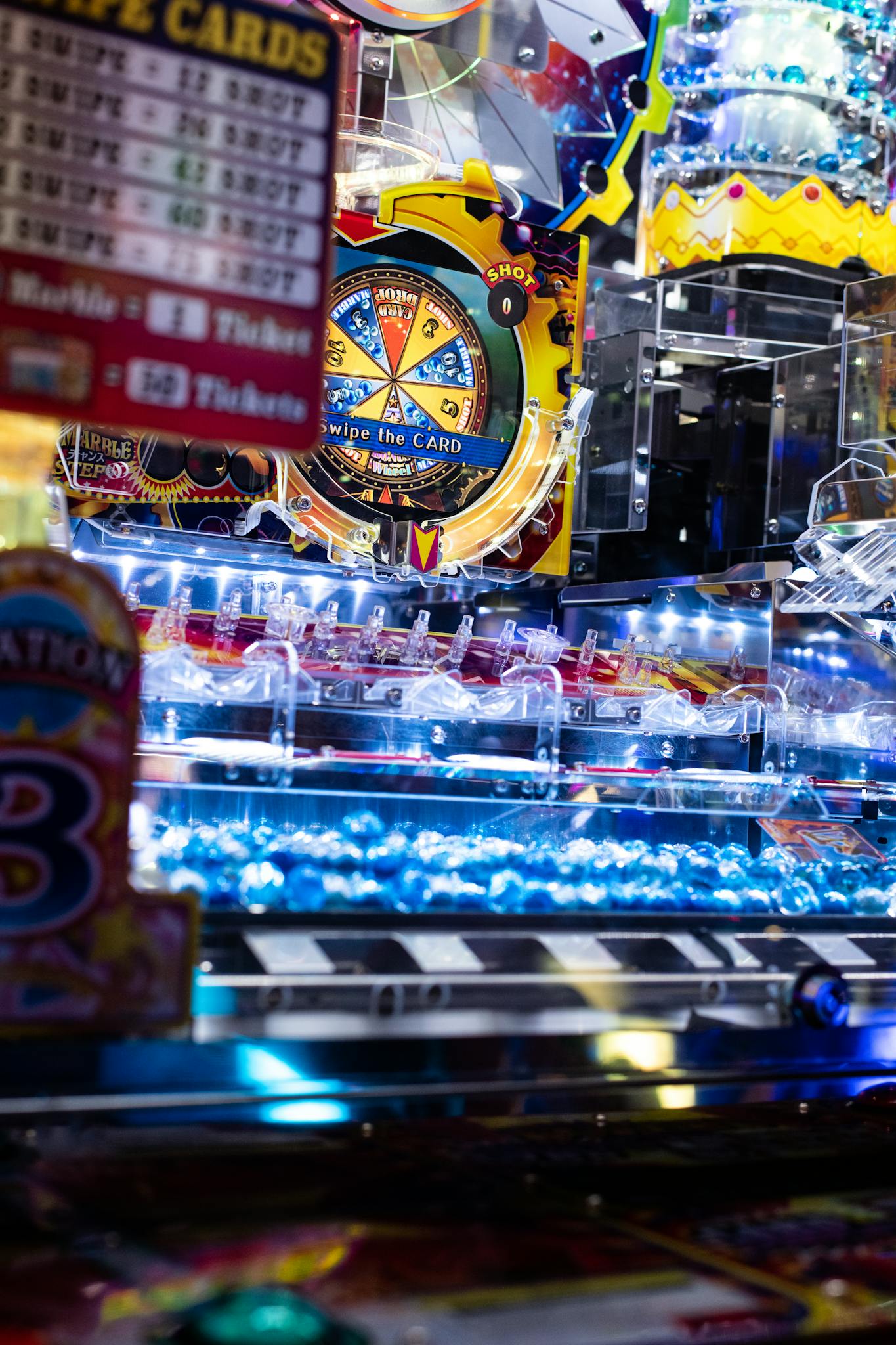 Lively pachinko game machine with colorful lights and vibrant displays inside an arcade setting.